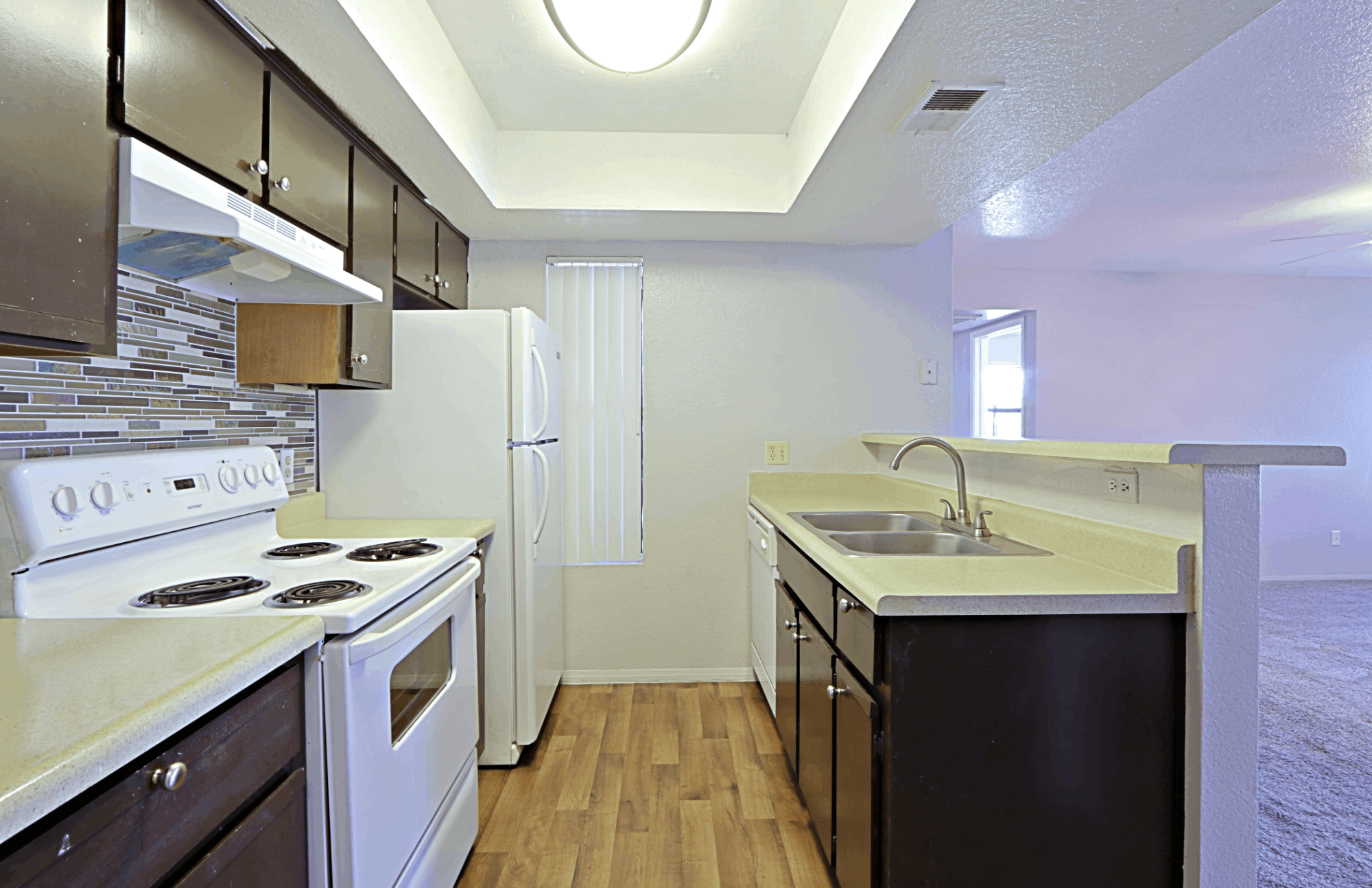 Apartment kitchen with outdated appliances